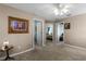 Well-lit hallway with access to multiple bedrooms at 3898 Beacon Ridge Way, Clermont, FL 34711