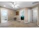 Spacious hallway with ceiling fan and access to bedrooms and bathroom at 3898 Beacon Ridge Way, Clermont, FL 34711