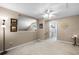 Spacious hallway with ceiling fan and access to bedrooms at 3898 Beacon Ridge Way, Clermont, FL 34711