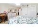 Charming bedroom with a queen bed and built-in wardrobe at 392 Arbella Loop, The Villages, FL 32162