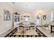 Dining room with a table, chairs and decorative rug at 392 Arbella Loop, The Villages, FL 32162