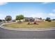 House exterior showing manicured lawn and screened patio at 392 Arbella Loop, The Villages, FL 32162