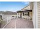 Front porch with seating and brick pavers at 392 Arbella Loop, The Villages, FL 32162