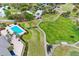 An aerial view of the golf course, pool and some of the neighborhood at 39656 Harbor Hills Blvd, Lady Lake, FL 32159