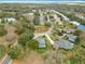 Aerial perspective of the neighborhood showcasing the community's layout and home's location near a pond at 39656 Harbor Hills Blvd, Lady Lake, FL 32159