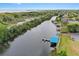 Aerial view featuring a canal with docks and boat houses at 39656 Harbor Hills Blvd, Lady Lake, FL 32159