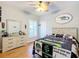 Bedroom featuring themed decor, wood flooring, and neutral-toned walls at 39656 Harbor Hills Blvd, Lady Lake, FL 32159