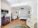 Bright main bedroom featuring an arched entrance, elegant decor, and a decorative rug at 39656 Harbor Hills Blvd, Lady Lake, FL 32159