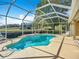 Sparkling pool with screen enclosure, perfect for outdoor relaxation and fun at 39656 Harbor Hills Blvd, Lady Lake, FL 32159