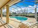 Inviting screened pool with lounge chairs and mature trees offering privacy at 39656 Harbor Hills Blvd, Lady Lake, FL 32159