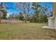 Backyard with wooden fence and open space at 40210 Orange Cir, Lady Lake, FL 32159