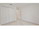 Bedroom with double door closet and carpet at 40210 Orange Cir, Lady Lake, FL 32159