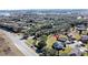 Aerial view highlighting a home's location near a main road and conservation area at 409 Silver Maple Rd, Groveland, FL 34736