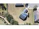 Aerial view of house with solar panels and large lot at 409 Silver Maple Rd, Groveland, FL 34736