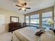 Well-lit bedroom featuring a comfortable bed and ample closet space at 409 Silver Maple Rd, Groveland, FL 34736