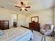 Spacious bedroom with ensuite bathroom access and large windows at 409 Silver Maple Rd, Groveland, FL 34736