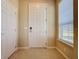 Inviting entryway with a neutral color palette and tile flooring at 409 Silver Maple Rd, Groveland, FL 34736