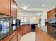 Modern kitchen with granite countertops and island at 409 Silver Maple Rd, Groveland, FL 34736