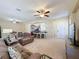 Bright living room, open concept view to kitchen at 409 Silver Maple Rd, Groveland, FL 34736