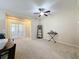 Carpeted living room with french doors and built-in shelving at 409 Silver Maple Rd, Groveland, FL 34736