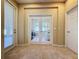 French doors leading to a sunlit office with carpeted floors at 409 Silver Maple Rd, Groveland, FL 34736