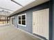 Back patio with sliding doors and exterior door at 41913 Cassia St, Eustis, FL 32736