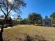 Large backyard with shed and fire pit at 41913 Cassia St, Eustis, FL 32736