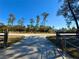 Long driveway leading to a house with trees on both sides at 41913 Cassia St, Eustis, FL 32736