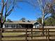 House exterior view with a brown wooden fence in front at 41913 Cassia St, Eustis, FL 32736