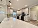 Modern kitchen with white cabinets and black appliances at 41913 Cassia St, Eustis, FL 32736