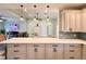 Kitchen island with seating and a view into the living area at 41913 Cassia St, Eustis, FL 32736