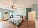 Spacious main bedroom with light blue walls and wood flooring at 41913 Cassia St, Eustis, FL 32736