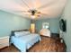 Spacious main bedroom with light blue walls and wood flooring at 41913 Cassia St, Eustis, FL 32736