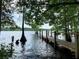 Long wooden dock stretching over tranquil lake at 41913 Cassia St, Eustis, FL 32736