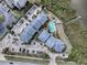 Community overview showcasing buildings, parking, and pool at 4870 S. Atlantic Ave, # 2040, New Smyrna Beach, FL 32169