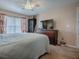 Comfortable bedroom featuring a large bed and window with blinds at 4870 S. Atlantic Ave, # 2040, New Smyrna Beach, FL 32169