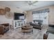 Living room with TV, seating, and coastal decor at 4870 S. Atlantic Ave, # 2040, New Smyrna Beach, FL 32169