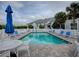 Inviting community pool with ample seating and patio at 4870 S. Atlantic Ave, # 2040, New Smyrna Beach, FL 32169