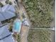 Aerial view of a community pool, boardwalk, and kayaks at 4870 S. Atlantic Ave, # 2040, New Smyrna Beach, FL 32169