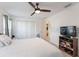 Bedroom with a queen bed, TV, and plenty of closet space at 4992 Big Cypress St, Oxford, FL 34484