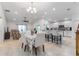 Open concept dining area with adjacent kitchen and living room at 4992 Big Cypress St, Oxford, FL 34484