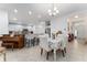 Bright dining room with open view to kitchen and entryway at 4992 Big Cypress St, Oxford, FL 34484