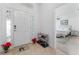 Bright entryway with tile flooring, stained glass, and view of bedroom at 4992 Big Cypress St, Oxford, FL 34484