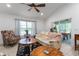 Bright living room featuring comfy seating and large windows at 4992 Big Cypress St, Oxford, FL 34484