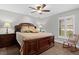 Comfortable bedroom with a large bed and rocking chair at 5055 County Road 125 # B1, Wildwood, FL 34785