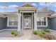 Gray house exterior with white columns and landscaping at 5055 County Road 125 # B1, Wildwood, FL 34785