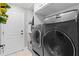 Laundry room with washer, dryer and extra storage at 5055 County Road 125 # B1, Wildwood, FL 34785