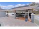 Outdoor kitchen and dining area under a covered patio at 5055 County Road 125 # B1, Wildwood, FL 34785