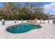 Kidney shaped swimming pool with a waterfall feature at 5055 County Road 125 # B1, Wildwood, FL 34785