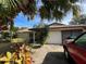 Single story house with palm trees and a red truck at 509 Jackson St, Eustis, FL 32726